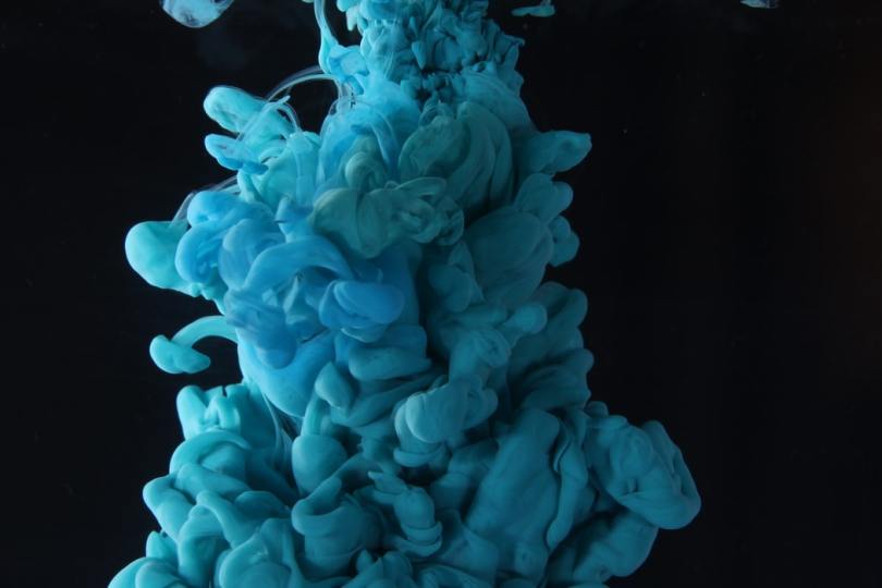blue-ink-dropped-in-water-with-black-background
