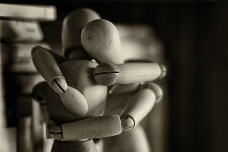 two-drawing-mannequins-embracing-in-black-and-white-as-depression-in-men-concept