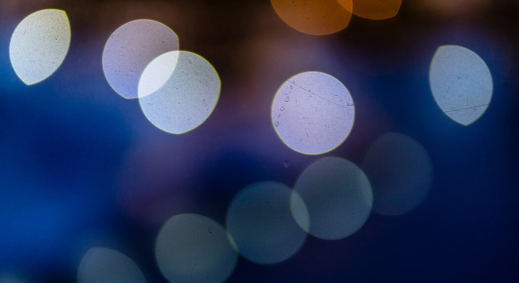 large-translucent-orbs-of-blue-and-purple-tones-on-dark-blurry-background